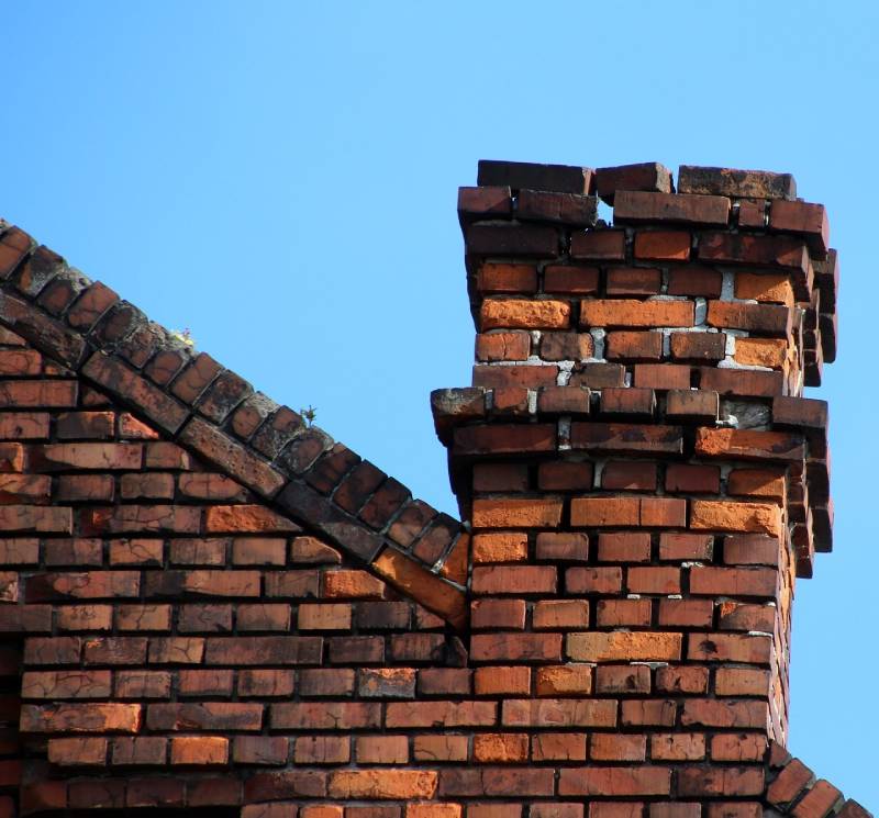 Signs Your National City Home Needs a Chimney Inspection Damaged chimney on an National City home showing cracks and missing mortar